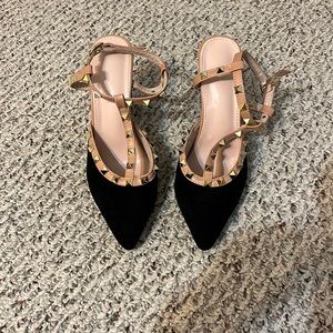 Black chunky heels with gold accents